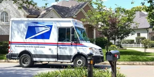 USPS truck delivering mail on a Saturday morning.