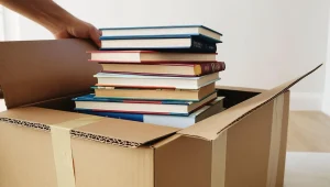 books being packaged into a box to send to a customer